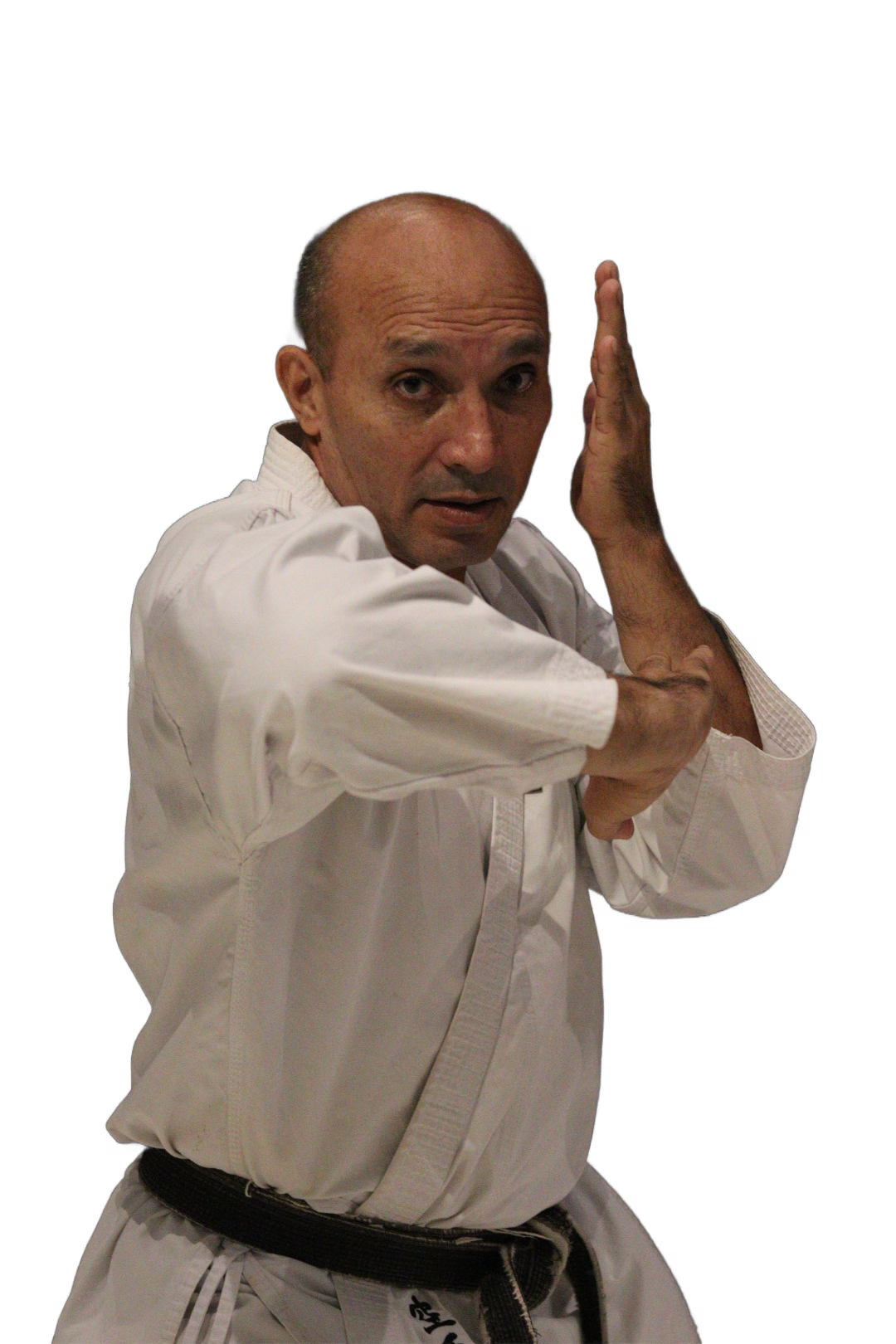 Sensei em posição de defesa com faixa preta